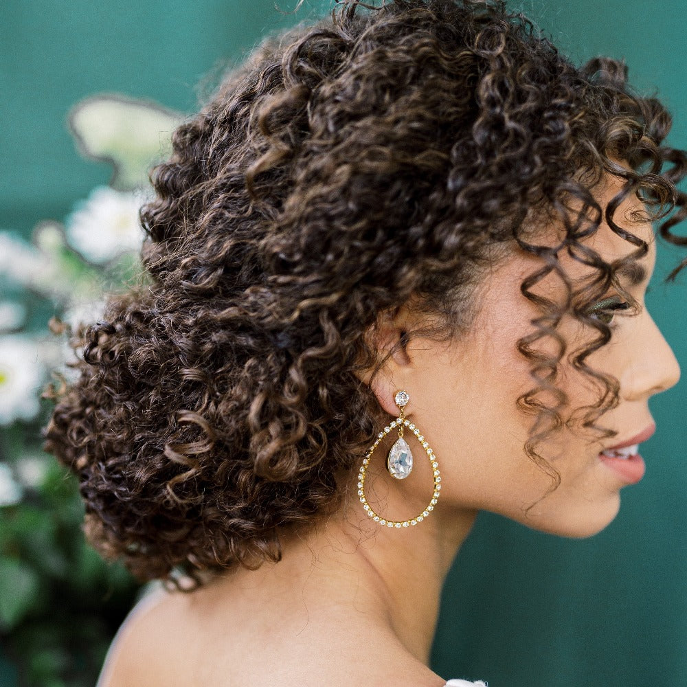 large gold or silver crystal rhinestone teardrop bridal earrings with large crystal drops in centre. Stud finish with large rhinestone studs. Made in Toronto Ontario Canada - Blair Nadeau Bridal Adornments - Available in 2 sizes for bride handmade in toronto canada by blair nadeau bridal adornments.